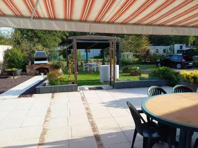 Jardin de l'établissement Maison confortable avec jardin, proche centre-ville et circuit 24h du Mans - FR-1-410-271
