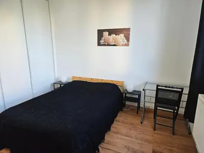 Un ou plusieurs lits dans un hébergement de l'établissement Appart T2 Quartier Beaujardin