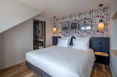 Un ou plusieurs lits dans un hébergement de l'établissement Ferdinand Hotel Tours