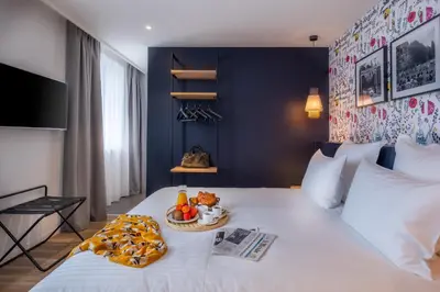 Un ou plusieurs lits dans un hébergement de l'établissement Ferdinand Hotel Tours
