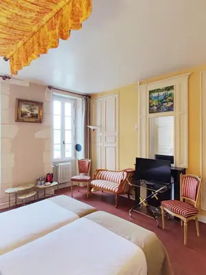 Un ou plusieurs lits dans un hébergement de l'établissement Chambres d'hôtes du domaine de l'Isle