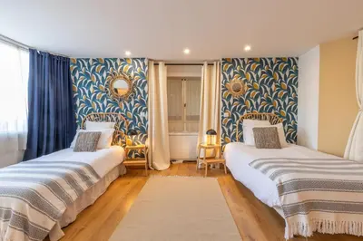 Un ou plusieurs lits dans un hébergement de l'établissement La Maison des Chalands