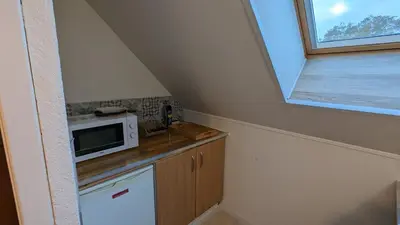 Cuisine ou kitchenette dans l'établissement Au Bonheur de Cisse
