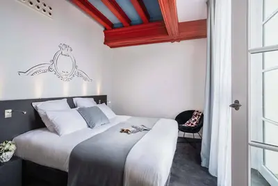 Un ou plusieurs lits dans un hébergement de l'établissement Best Western Premier Hotel de la Cite Royale
