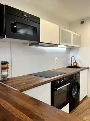 Cuisine ou kitchenette dans l'établissement Moderne appartement - Gare - centre-ville