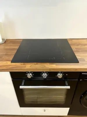 Cuisine ou kitchenette dans l'établissement Moderne appartement - Gare - centre-ville