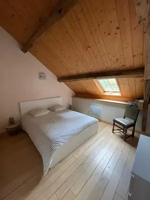 Un ou plusieurs lits dans un hébergement de l'établissement Le Moulin de Cherré gîte vert