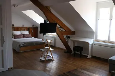 Un ou plusieurs lits dans un hébergement de l'établissement Le Studio de Sophie