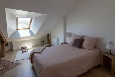 Un ou plusieurs lits dans un hébergement de l'établissement APPARTEMENT DUPLEX SAUMUR CENTRE, refait à neuf, à proximité du château