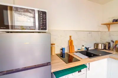 Cuisine ou kitchenette dans l'établissement Le Chanzy-Terrasse privative