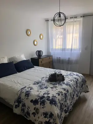 Un ou plusieurs lits dans un hébergement de l'établissement LA PETITE MAISON DE TATATE