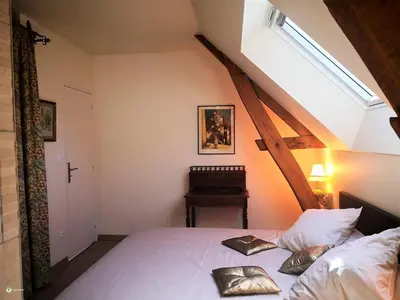 Un ou plusieurs lits dans un hébergement de l'établissement Gîte élégant en Touraine avec jardin clos et WIFI - FR-1-381-505