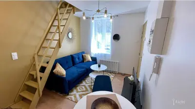 Coin salon dans l'établissement A la Clef - Duplex cosy proche gare et centre - Idéal PRO & Couple - WIFI