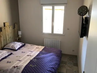 Un ou plusieurs lits dans un hébergement de l'établissement Cottage piscine intérieure31degrés ZOO LA FLECHE24H du Mans