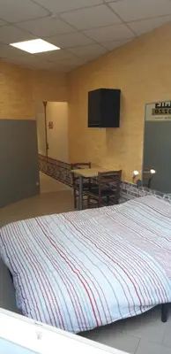 Un ou plusieurs lits dans un hébergement de l'établissement À 200m du Château 30 min du Circuit du Mans
