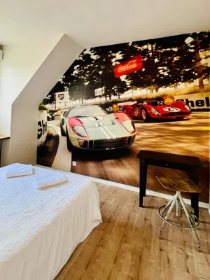 Un ou plusieurs lits dans un hébergement de l'établissement Maison 1440 - STORIES, logement Atypique Sport Auto