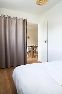 Un ou plusieurs lits dans un hébergement de l'établissement Appartement cosy avec parking privé à Saumur
