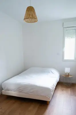 Un ou plusieurs lits dans un hébergement de l'établissement Appartement cosy avec parking privé à Saumur
