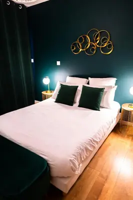 Un ou plusieurs lits dans un hébergement de l'établissement Grand loft familial 4 chambres avec parking privé