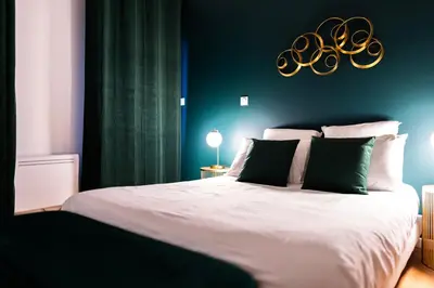 Un ou plusieurs lits dans un hébergement de l'établissement Grand loft familial 4 chambres avec parking privé
