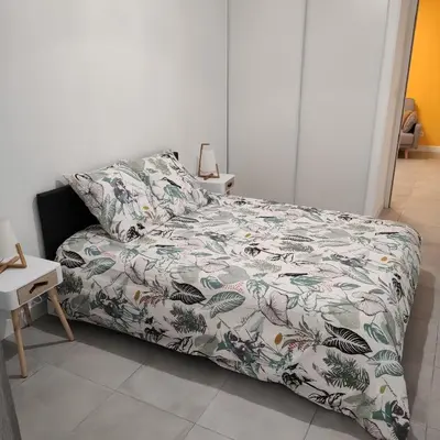 Un ou plusieurs lits dans un hébergement de l'établissement Appartement Cosy avec place de parking privée