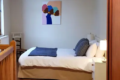 Un ou plusieurs lits dans un hébergement de l'établissement Gites Aubelle - La Maison Aubelle
