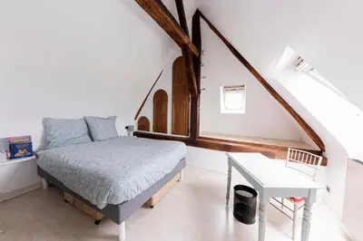 Un ou plusieurs lits dans un hébergement de l'établissement La Lirosane, 3 studios, 3,7km du Zoo, Centre-ville