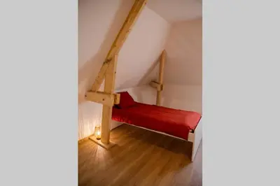 Un ou plusieurs lits dans un hébergement de l'établissement l'Atelier du menuisier