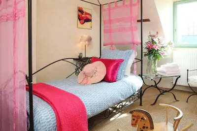 Un ou plusieurs lits dans un hébergement de l'établissement Une Maison, Un Jardin