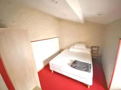 Un ou plusieurs lits dans un hébergement de l'établissement Maison charmante à Mouterre-Silly avec jardin privé