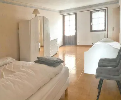 Un ou plusieurs lits dans un hébergement de l'établissement Maison charmante à Mouterre-Silly avec jardin privé