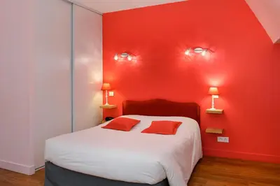 Un ou plusieurs lits dans un hébergement de l'établissement Logis Manoir De La Giraudière