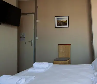 Un ou plusieurs lits dans un hébergement de l'établissement lhotel