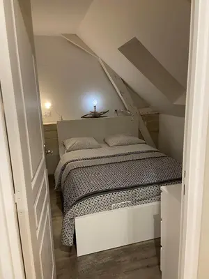 Un ou plusieurs lits dans un hébergement de l'établissement Appartement du Château de la Caillerie