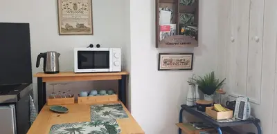 Télévision ou salle de divertissement dans l'établissement At home