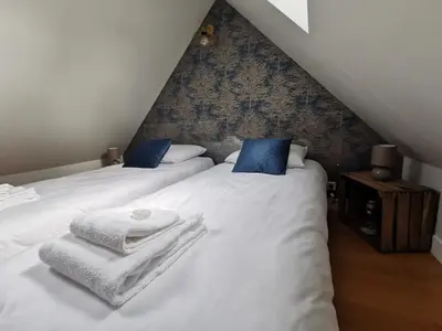 Un ou plusieurs lits dans un hébergement de l'établissement Le Gatsby - Duplex art déco au coeur de Blois