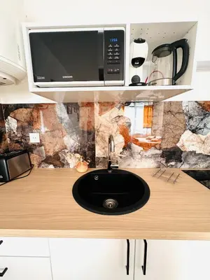 Cuisine ou kitchenette dans l'établissement COUP DE CŒUR - HYPER CENTRE - WIFI