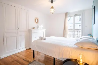 Un ou plusieurs lits dans un hébergement de l'établissement La Maison Lamartine Havre de paix dans le centre de Tours