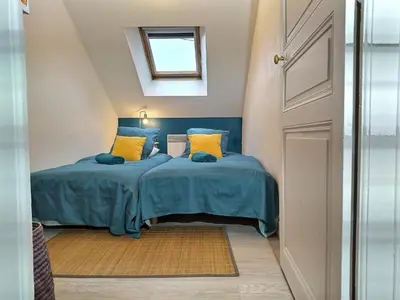 Un ou plusieurs lits dans un hébergement de l'établissement Maison Chic & charme Calme avec Jardin