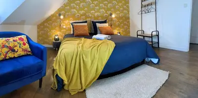 Un ou plusieurs lits dans un hébergement de l'établissement Maison Chic & charme Calme avec Jardin
