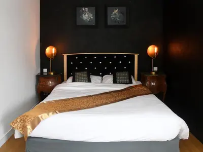 Un ou plusieurs lits dans un hébergement de l'établissement Logis Auberge De Launay