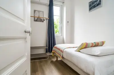 Un ou plusieurs lits dans un hébergement de l'établissement Maison tout confort, parking, clim, garage 3ch 5p
