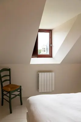 Un ou plusieurs lits dans un hébergement de l'établissement Gite de Vonnes