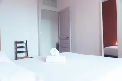 Un ou plusieurs lits dans un hébergement de l'établissement Le Ronsardien - Appartement calme et confortable