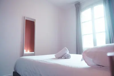 Un ou plusieurs lits dans un hébergement de l'établissement Le Ronsardien - Appartement calme et confortable