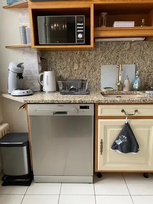 Cuisine ou kitchenette dans l'établissement L Ensorcel Mans, séjour magique en coeur de ville