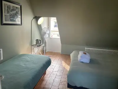 Un ou plusieurs lits dans un hébergement de l'établissement Chambre Sixtine