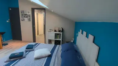 Un ou plusieurs lits dans un hébergement de l'établissement LOFT 2 Descartes