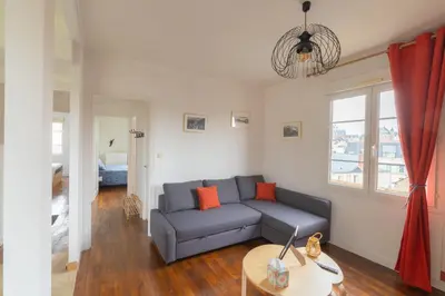 Coin salon dans l'établissement Appartement Cosy avec garage privé