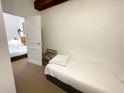 Un ou plusieurs lits dans un hébergement de l'établissement Maison des fleurs